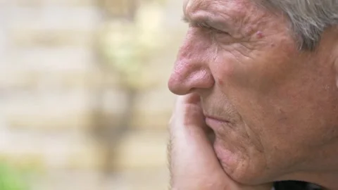 Side View of Worried Mature Man Outdoors Lost in Difficult Thoughts 動画素材 334776046