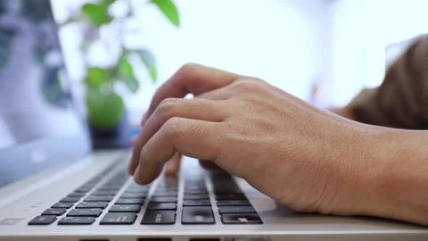 Side view writing on a keyboard with two hands office person working sheet Stock-Footage 336585594
