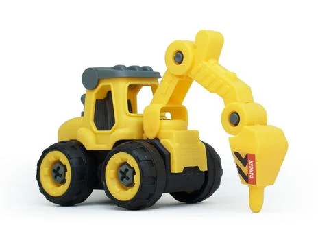 Side view of yellow plastic tractor drill toy isolated on white background... Stock Photos