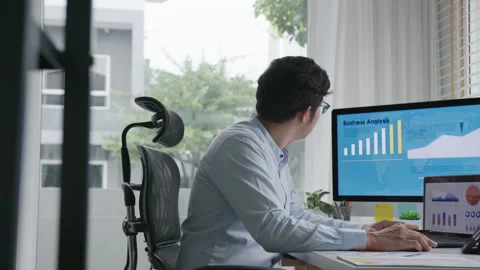 Side view of young attractive asian thai man busy work multiple screen 스톡 동영상 142900337
