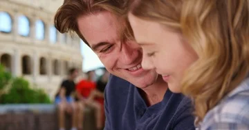 Side view of young attractive couple in Rome chatting and using technology Stock-Footage 85807006