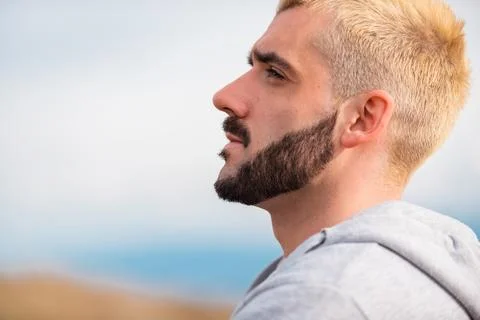 Side view of young bearded man. Stock Photos