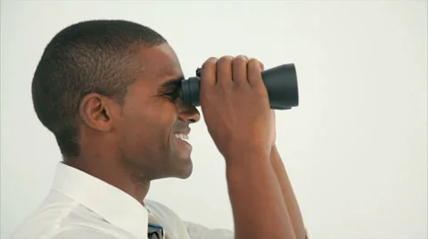 Side view of young businessman looking through binoculars Stock Footage 52686754