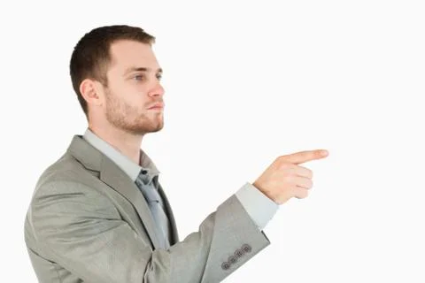 Side view of young businessman using futuristic touchscreen Stock Photos