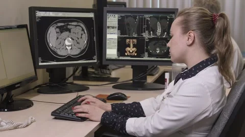Side view of young doctor typing on computer Stock Footage 62347895