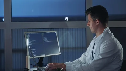 Side view of young electronics engineer being engaged in his research on Stock Footage 112868595