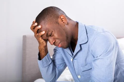 Side View Of A Young Man With Headache Photos