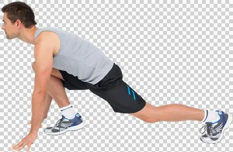 Side view of a young man in ready to run posture Stock Photos