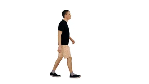 Side view of young man walking in black T-shirt and shorts, alpha channel Video stock 90052202