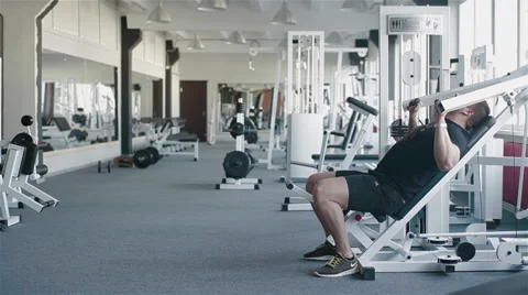 Side view of a young man working out in gym Stock Footage 49162430