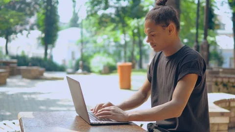 Side view young man working in park Stock Footage 112952993