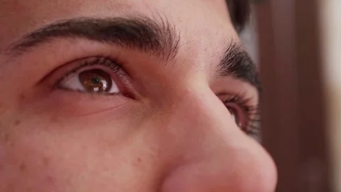 Side view of young man's eyes opening, embracing the future Video stock 277322416