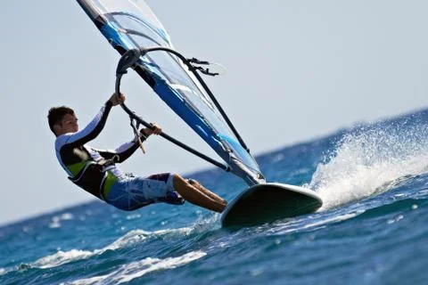 Side view of young windsurfer Stock Photos