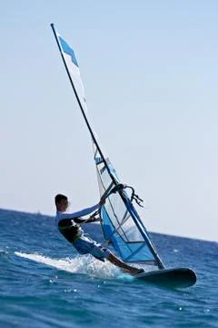 Side view of young windsurfer Stock Photos