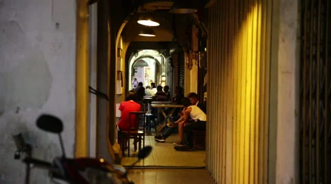 Side walk cafe through archway and motorcycle Stock-Footage 48140675