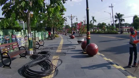 Side Walk with Wires and Some Workers Stock Footage 218628329