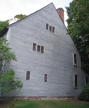 Side wall and windows of a house Stock Photos