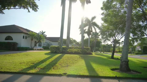 Side wide view POV car driving on street in Naples Florida. road with cars in Stock-Footage 258595109