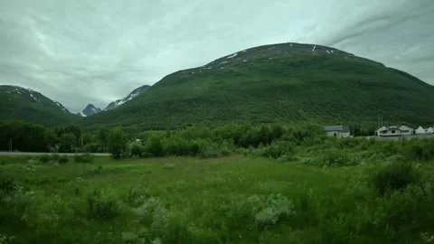 Side window view passing Lyngseidet road sign and mountain in Northern Norway 動画素材 341272657
