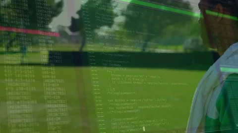 Sideline player watching team running, green code HUD fading from top-left Stock Footage 331062985
