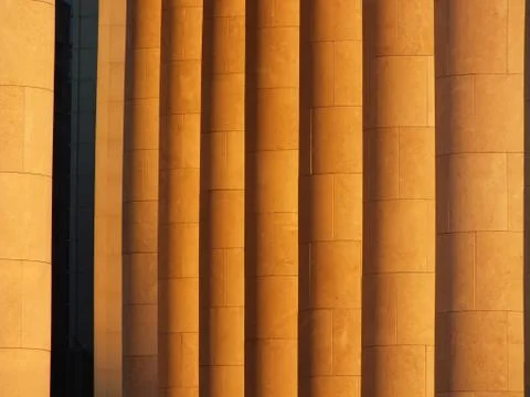A sidelit colonnade as background Stock Photos