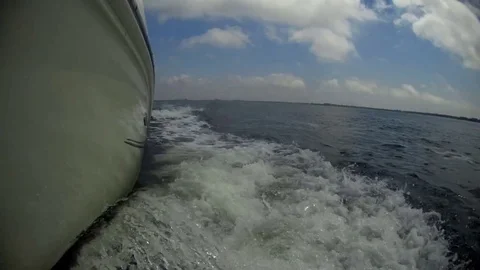 SideofBoatCuttingThroughLakeSpeedboatinWater Stock Footage 105880933