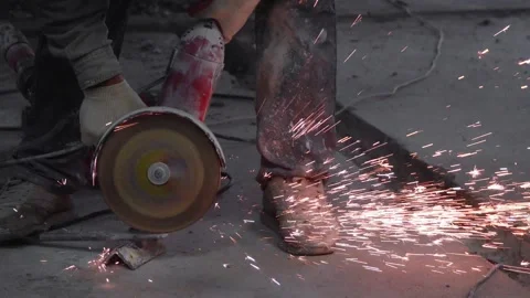 The sides fly bright sparks from the angle grinder machine. Stock Footage 328982726