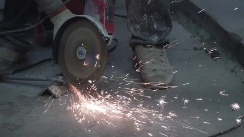 The sides fly bright sparks from the angle grinder machine. Stock Footage 328982729