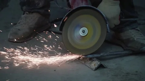 The sides fly bright sparks from the angle grinder machine. Stock Footage 328982731