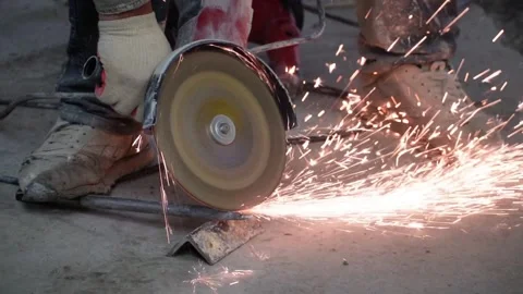 The sides fly bright sparks from the angle grinder machine. Stock Footage 328982735