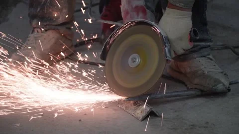 The sides fly bright sparks from the angle grinder machine. Stock Footage 329798898