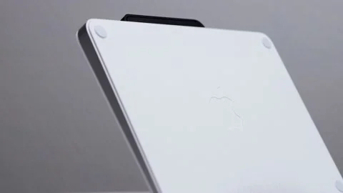 Sideview and reveal of Mac magic trackpad upright on display with Apple Stock Footage 172534381