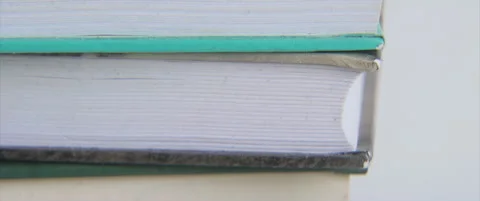 Sideview of book stack slow sliding 4K scope video Stock Footage 321181068