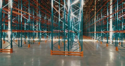 Sideview inside warehouse. Sun reflections on metal. Rows of metallic frameworks Stock Footage 135513754