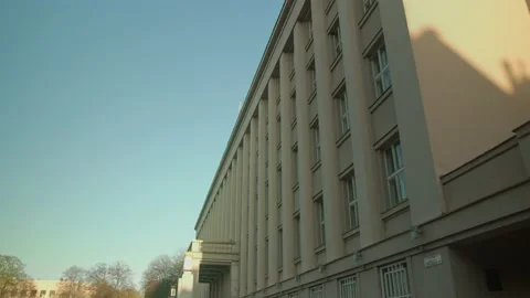 Sideview of modernism style building with columns in dawn with clear sky on the Video stock 135056478