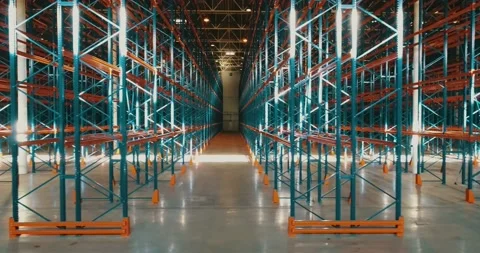 Sideview of rows of metallic frameworks inside the warehouse. Sun reflections on Video stock 135513810