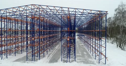 Sideview of warehouse construction site. Metallic framework. Clear sky on the Stock Footage 135058090