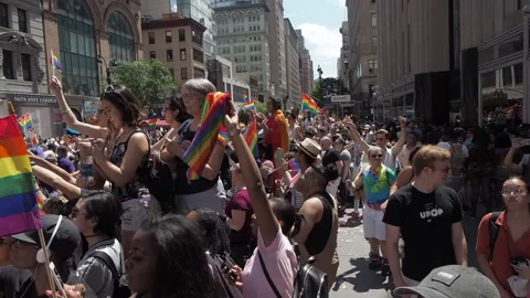 Sidewalk and parade, Rainbow flags. Gay pride parade. NYC Stock Footage 210226848