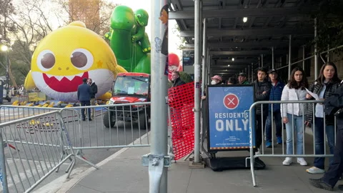 Sidewalk is blocked off during preparations for Macy's Thanksgiving Day Parade Stock Footage 230726274