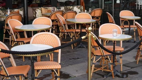 Sidewalk cafe  with small round tables and empty chairs - coffeehouse, coffee Stock Footage 232086132