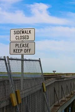 Sidewalk closed, please keep off signs closing a sidewalk Stock Photos