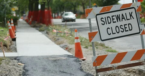 Sidewalk Closed Sign Rack Focus to Sidewalk Stock Footage 65730539
