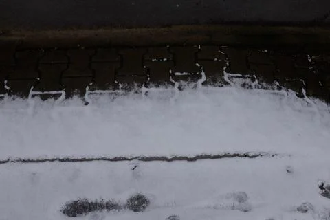 Sidewalk covered by snow Stock Photos