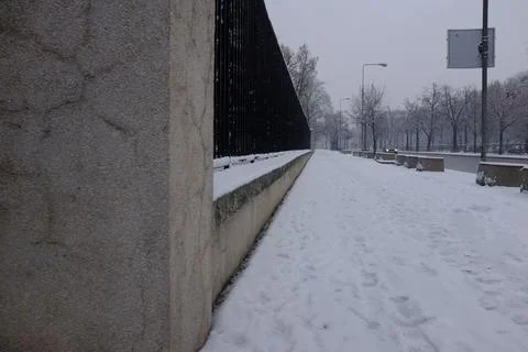 Sidewalk covered by snow Stock Photos