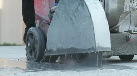 Sidewalk cutting machine with sparks Stock Footage 11025992