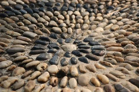 Sidewalk decorate by circle rocks pattern on concreate floor vintage design Fotos Stock