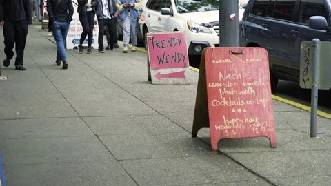 Sidewalk A frame signs in front of shops in Seattle Stock Footage 73497231