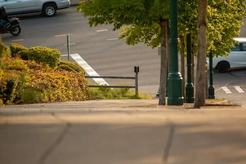 A sidewalk going downhill. Stock Photos