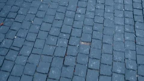 A sidewalk laid with yellow, red, grey and white colors paving stone Stock Footage 340454824