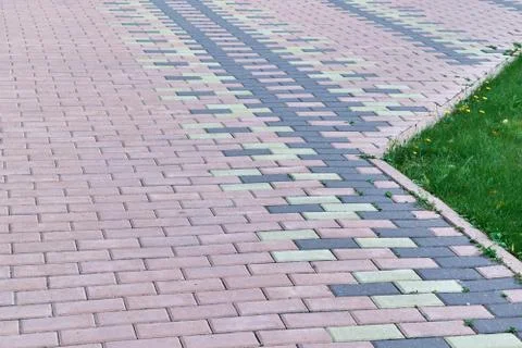 The sidewalk is lined with stone blocks of rectangular shape. 写真素材